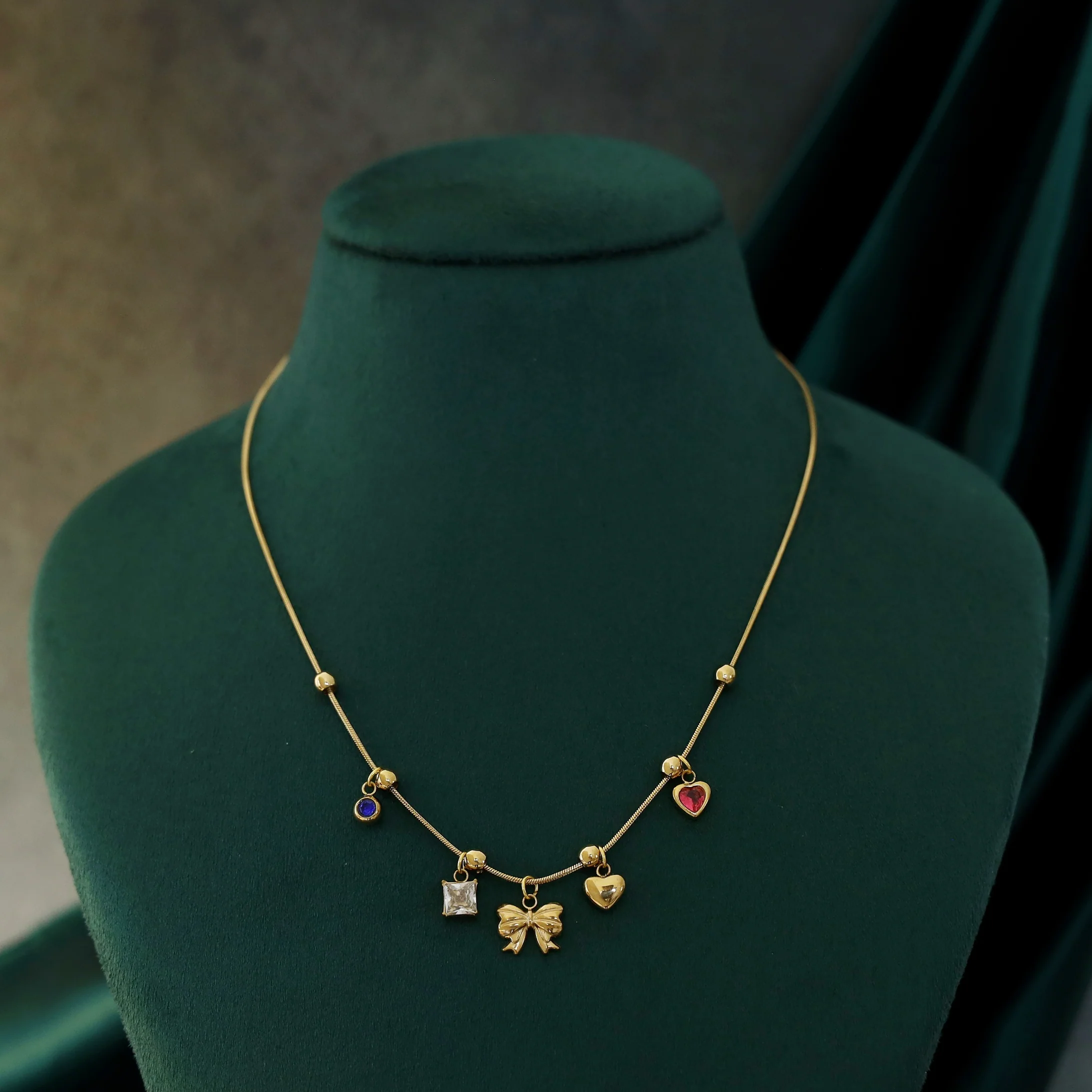 Serlin Golden Ball Ribbon Heart Glossy Charm Neckpiece - Image 2
