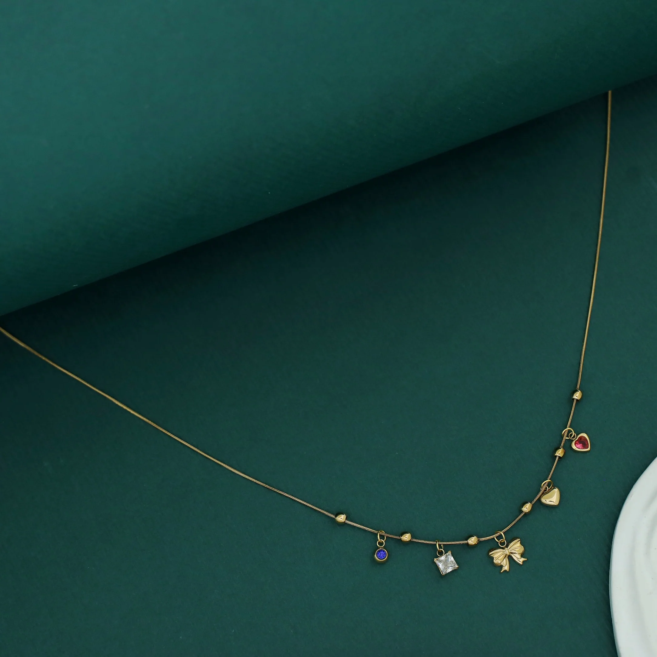 Serlin Golden Ball Ribbon Heart Glossy Charm Neckpiece - Image 3
