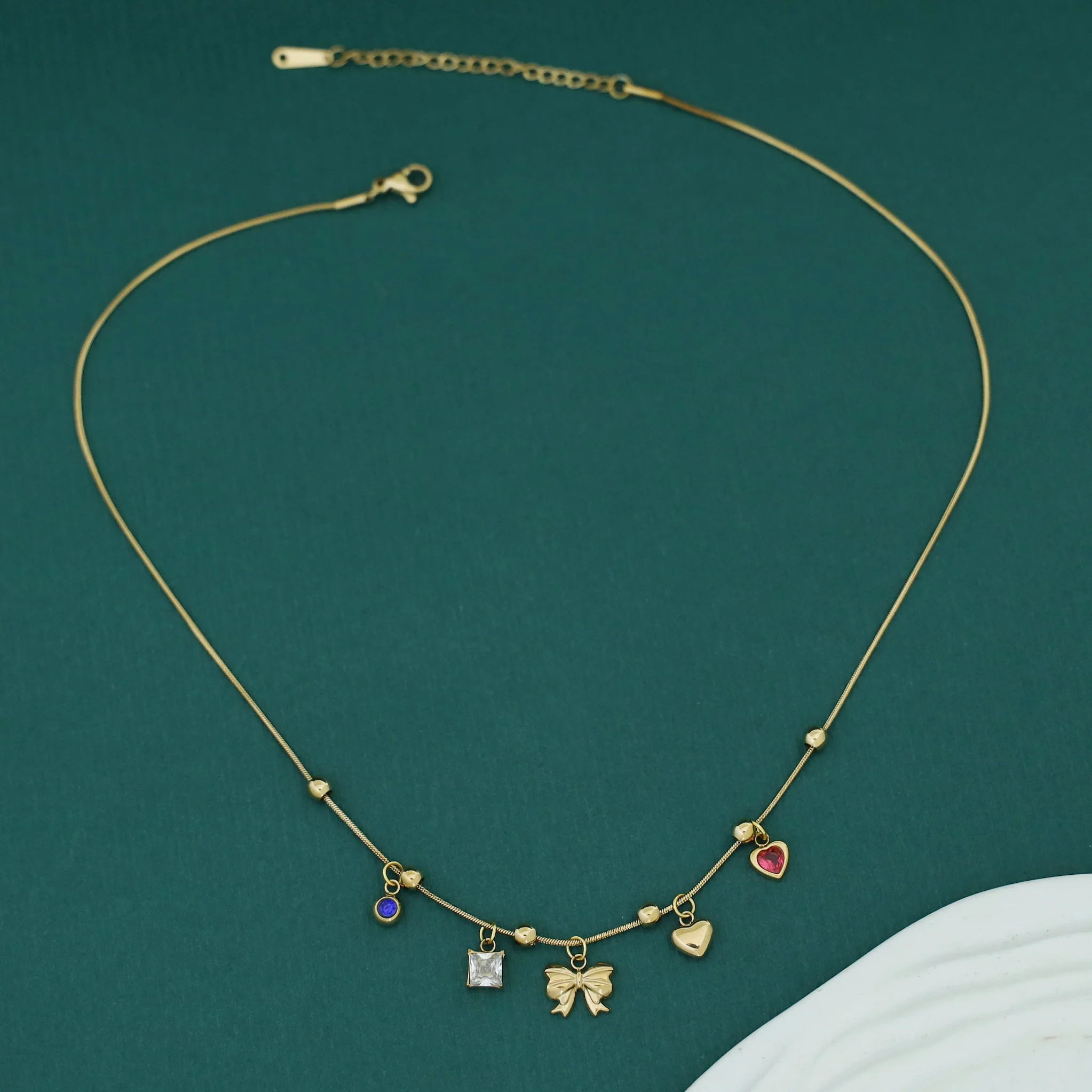 Serlin Golden Ball Ribbon Heart Glossy Charm Neckpiece - Image 4